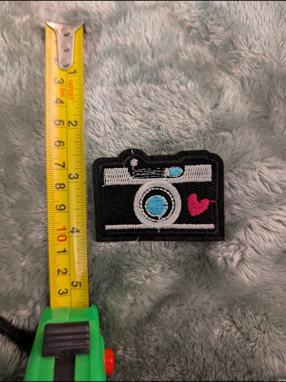 Embroidered Camera Iron On Patch - Black with Blue Lens and Pink Heart